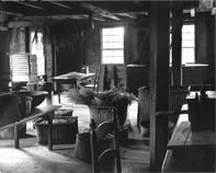 SA1711 - Interior of an attic, showing tables, chairs, baskets with herbs, etc. Identified on the back., Winterthur Shaker Photograph and Post Card Collection 1851 to 1921c
